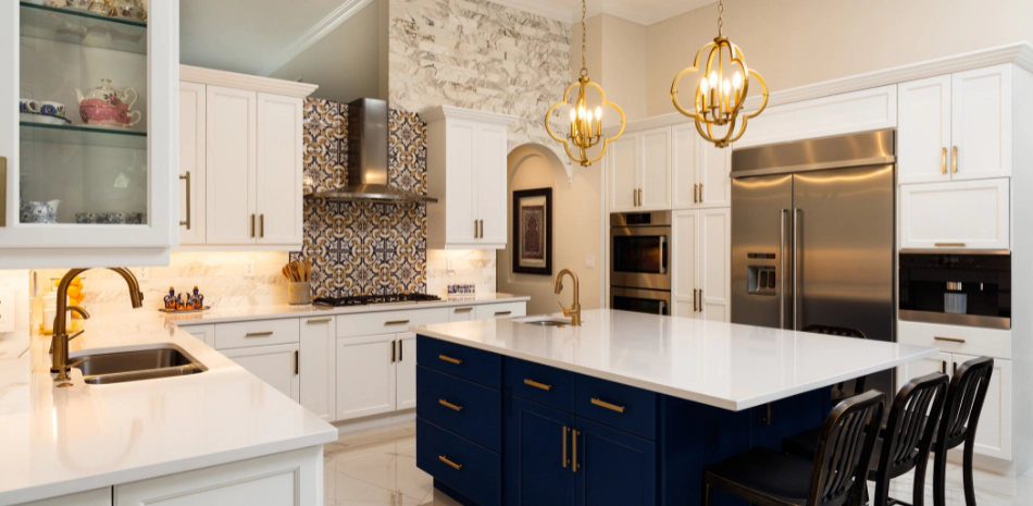 a newly remodeled kitchen with gold accents